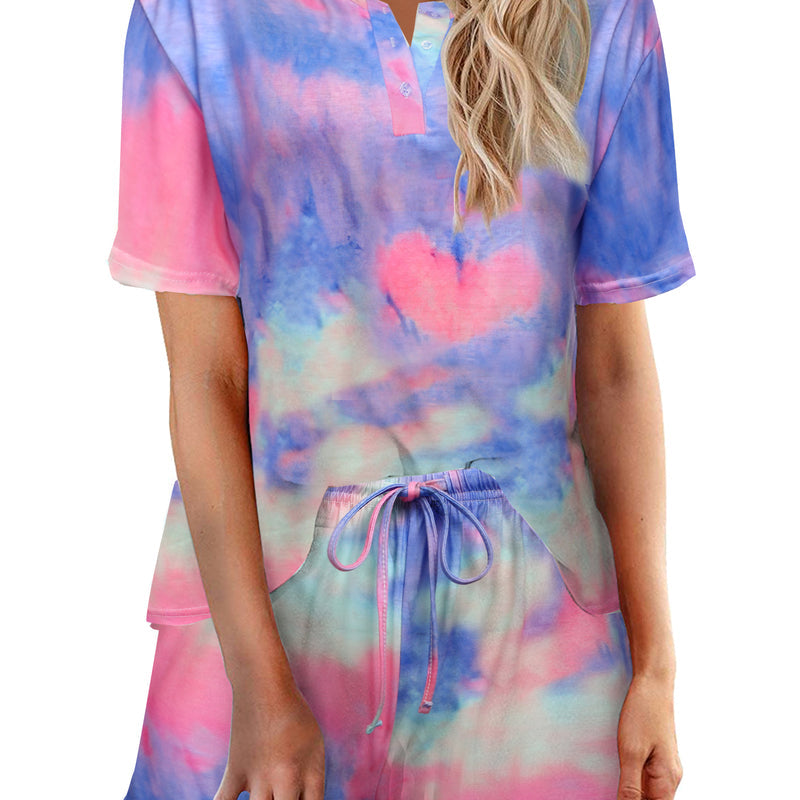 Women’s tie-dye pajama set in pastel blue and pink; short-sleeve button top with drawstring elastic waist shorts