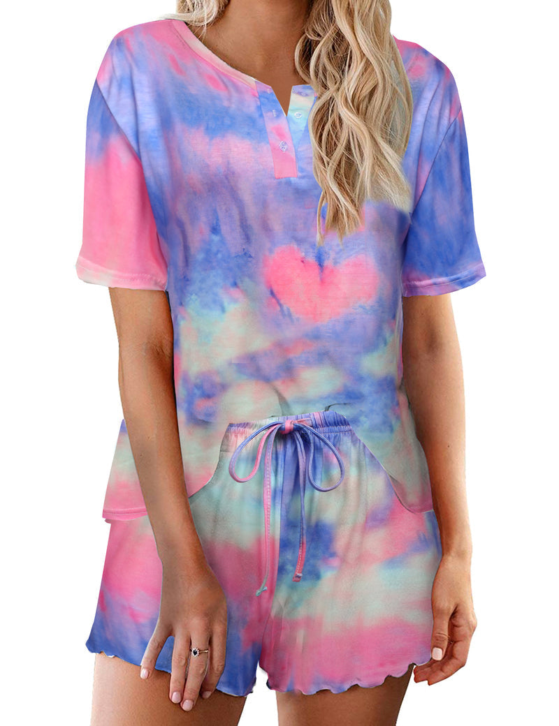Women’s tie-dye pajama set in pastel blue and pink; short-sleeve button top with drawstring elastic waist shorts