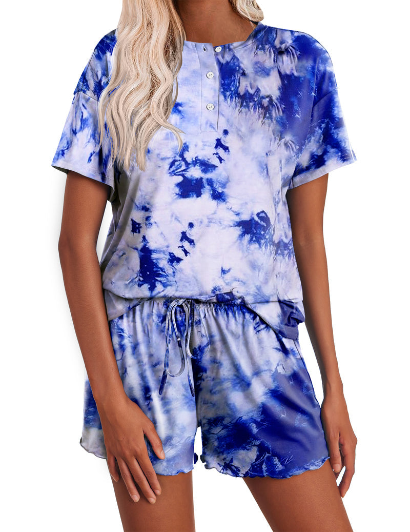 Women’s tie-dye pajama set in blue; short-sleeve button henley top with matching drawstring shorts