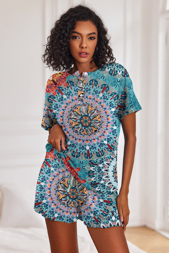 Women's blue patterned short-sleeve pajama set with button top and drawstring shorts