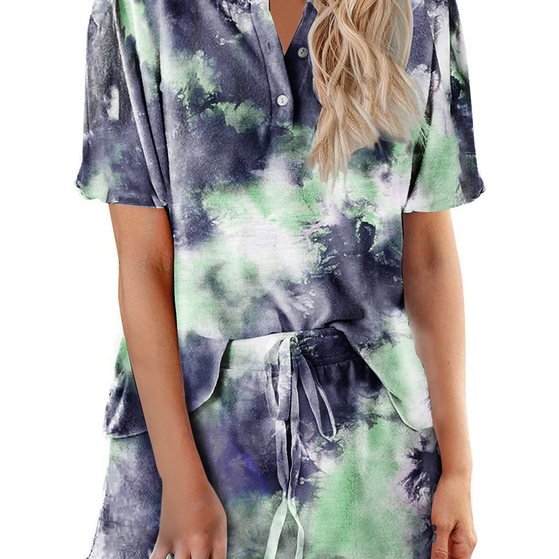 Women’s tie-dye pajama set in dark navy with green and light purple; short-sleeve button top, drawstring shorts