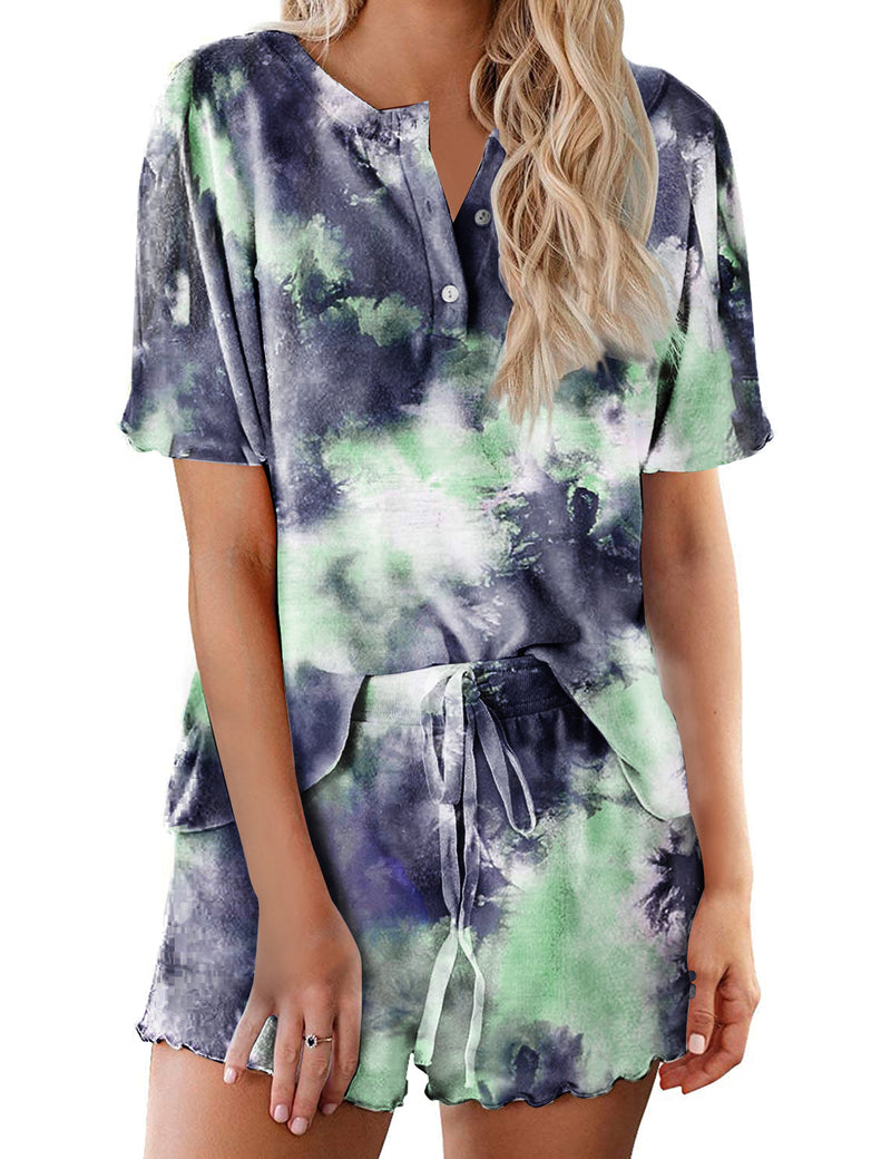Women’s tie-dye pajama set in dark navy with green and light purple; short-sleeve button top, drawstring shorts