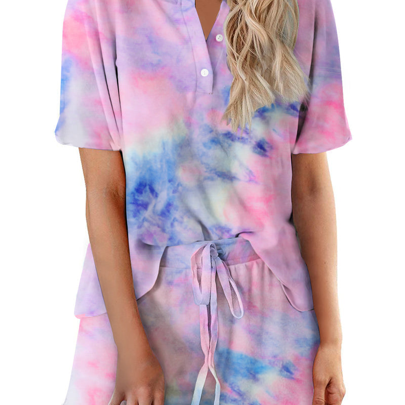 Women’s tie-dye pajama set in pink, blue, and purple; short-sleeve button top with drawstring shorts