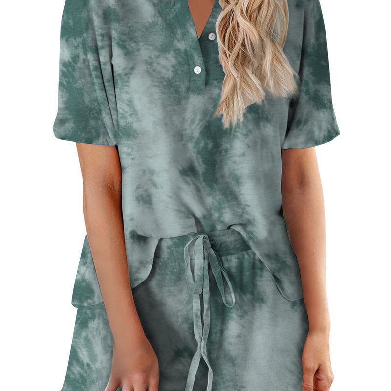Women’s green tie-dye pajama set with short-sleeve button-up top and matching drawstring shorts