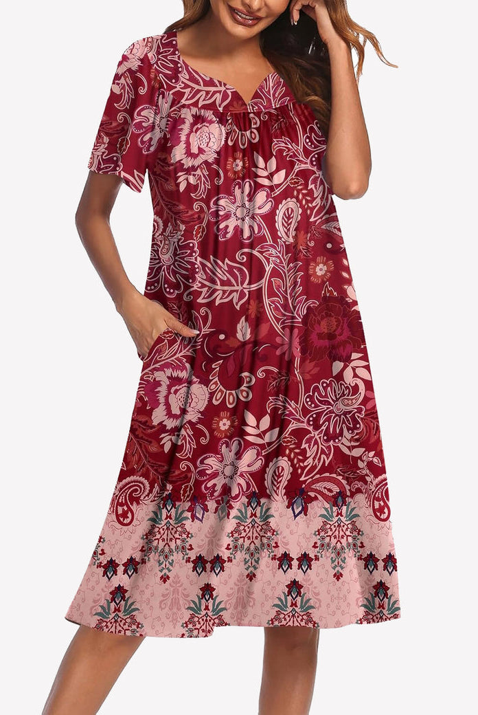 Short-sleeve lounger nightgown with burgundy and blush floral border print, V-neck and gathered chest.