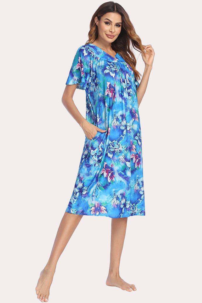 Short-sleeve lounger nightgown in bright blue floral print with a V-neck and relaxed fit.