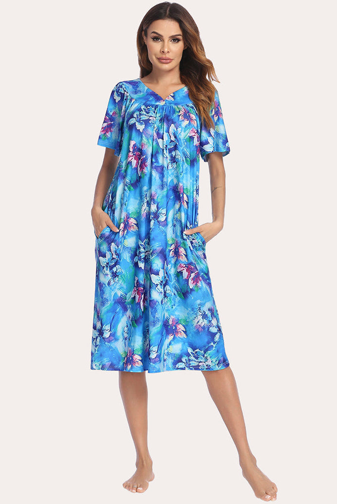 Short-sleeve lounger nightgown with blue floral pattern, V-neck, and knee-length relaxed drape.