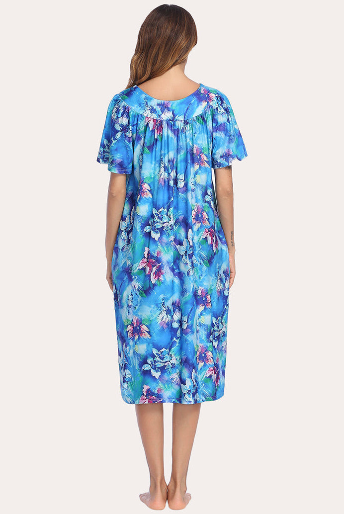 Short-sleeve lounger nightgown from back view, blue floral print with gathered neckline and flared sleeves.