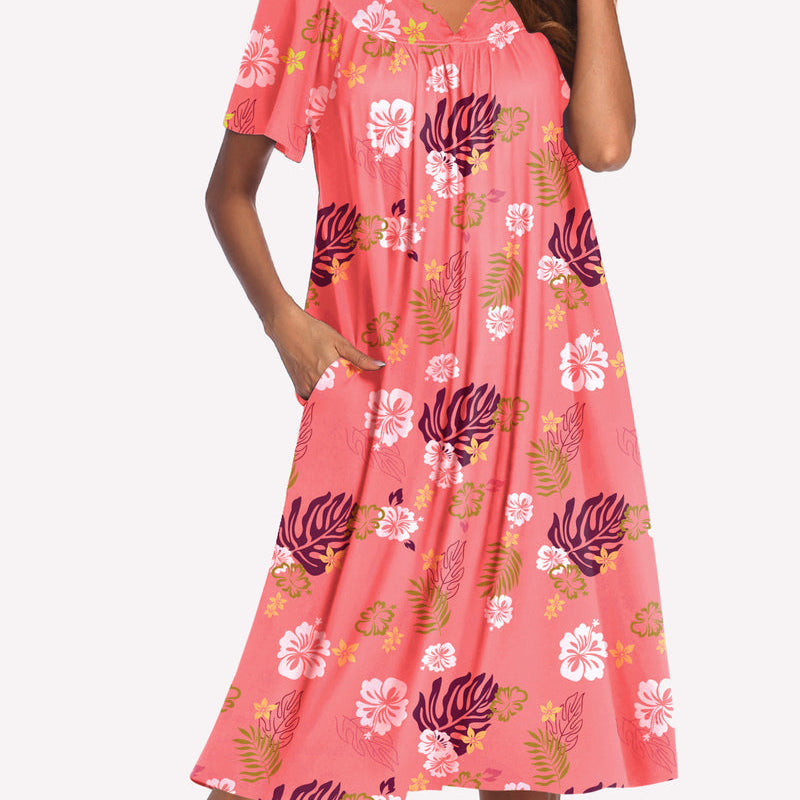 Short-sleeve lounger nightgown in pink with colorful floral and leaf print, V-neck and gathered bodice.