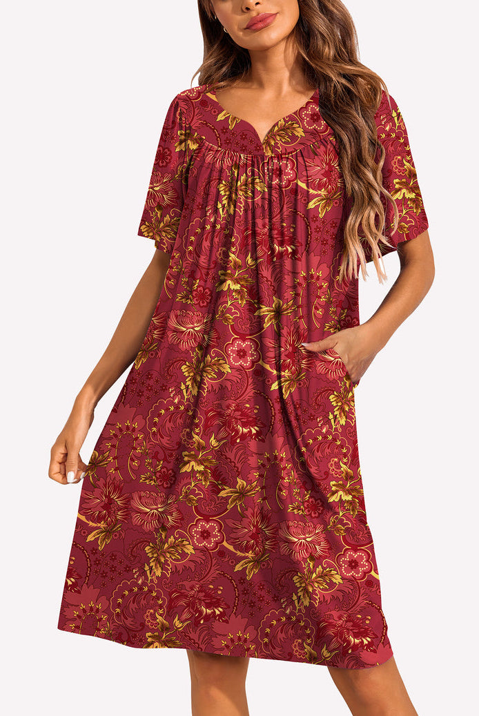 Short-sleeve lounger nightgown in dark red with gold floral baroque print, gathered V-neck.
