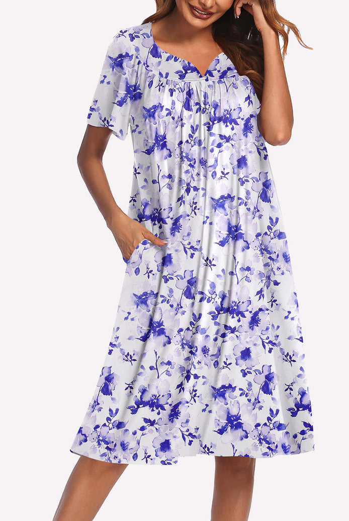 Women’s short-sleeve nightgown in white with blue floral print, ruffled round neckline