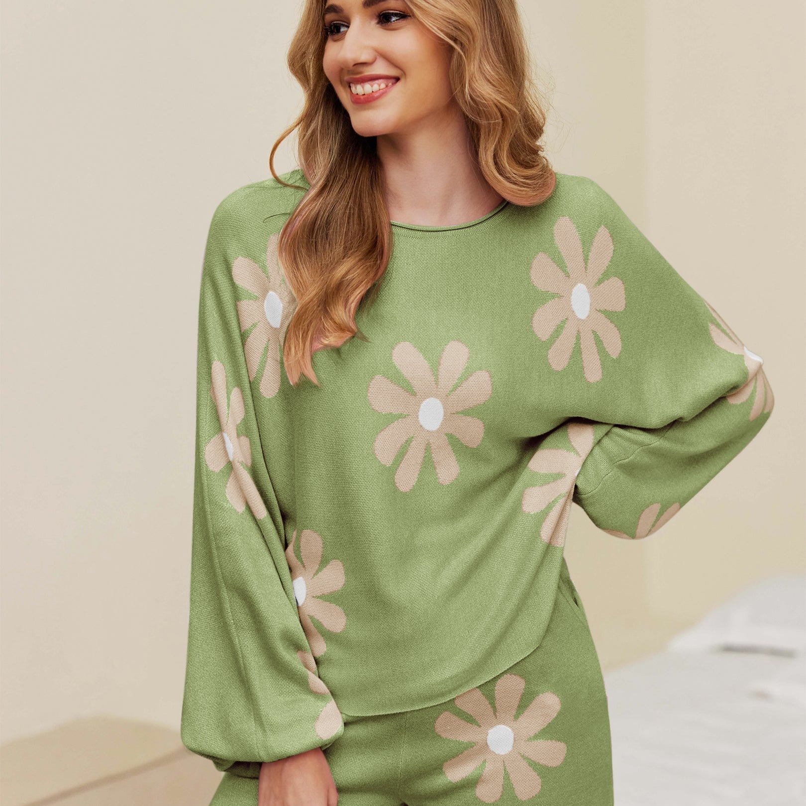Green pajama set with long sleeves and shorts, white daisy print and elastic waistband