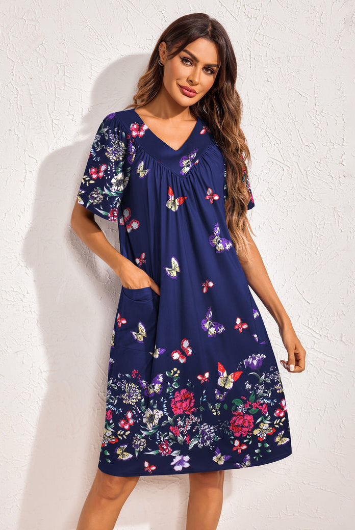 Navy floral nightdress with V-neck and gathered neckline, short sleeves, side pockets