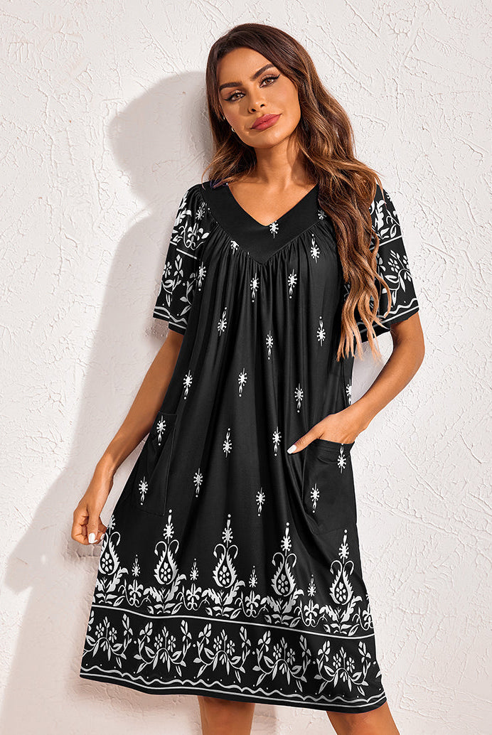 Floral print nightdress in black with white motif border, V-neck, short sleeves, side pockets