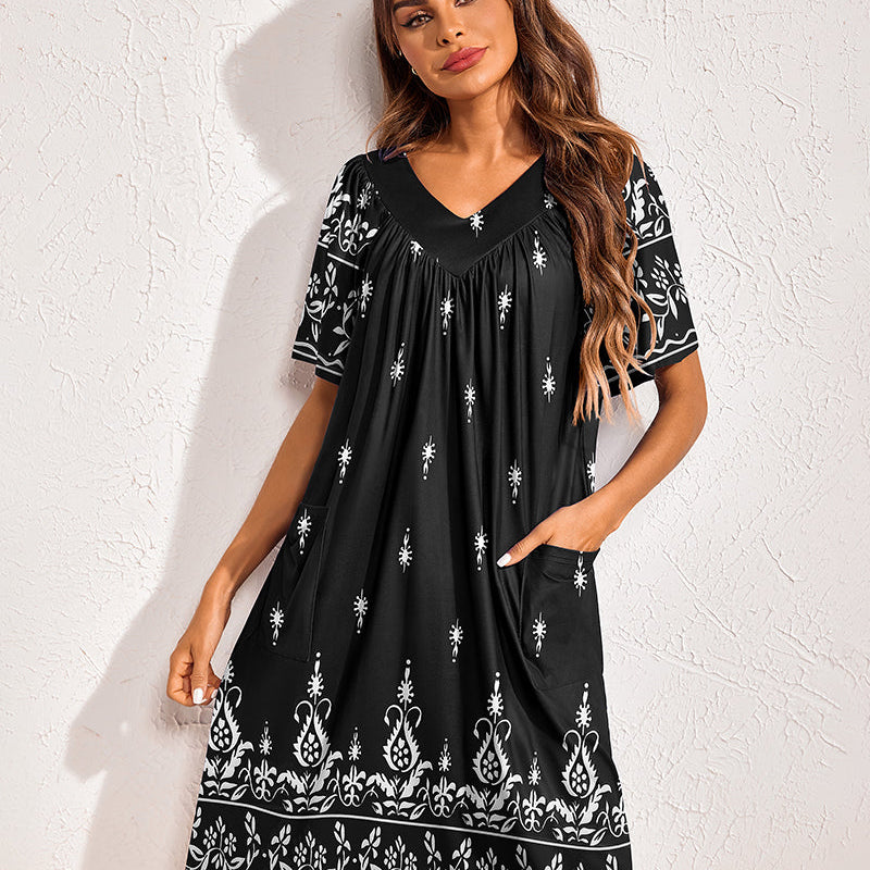 Floral print nightdress in black with white motif border, V-neck, short sleeves, side pockets