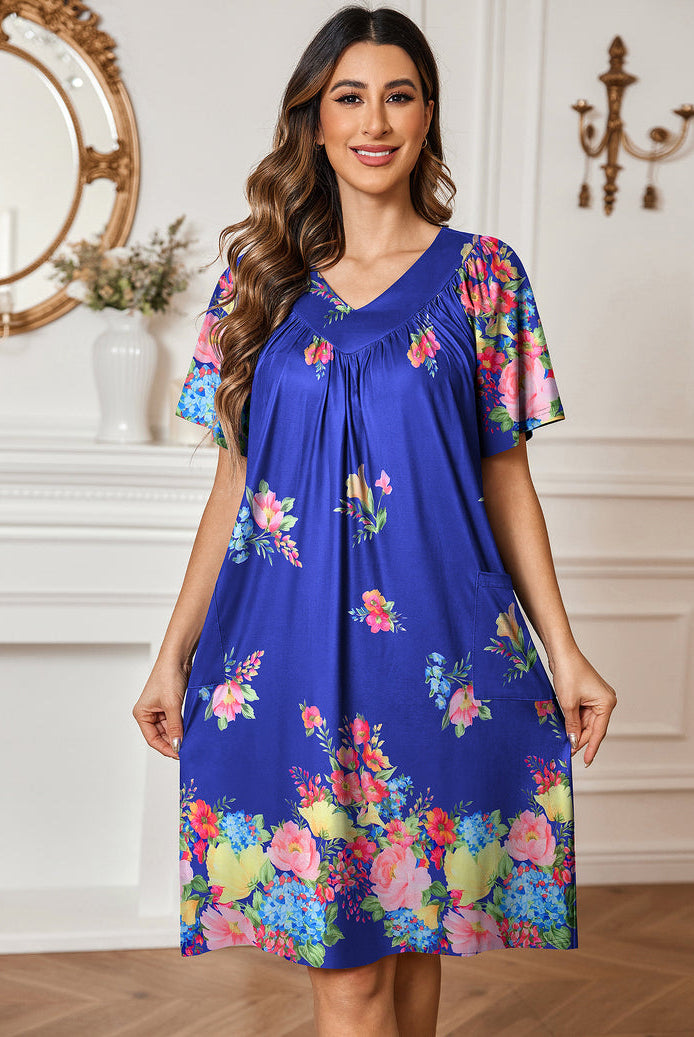 Blue floral nightdress with V-neck and gathered neckline, short sleeves, side pockets