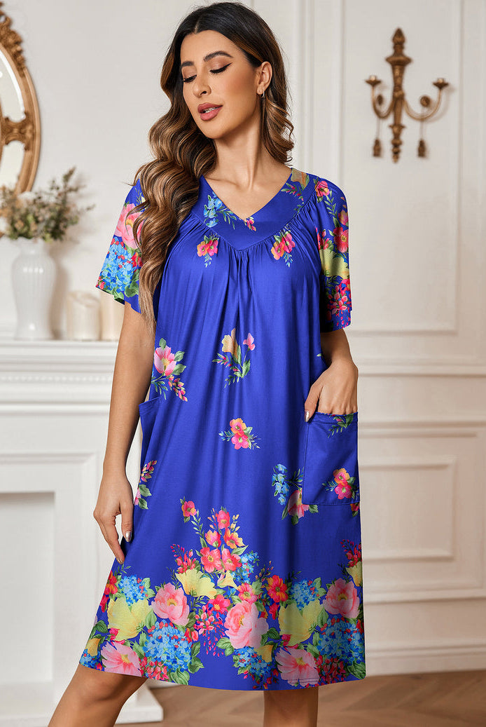 Blue floral nightdress with V-neck, gathered bodice, short sleeves, side pockets