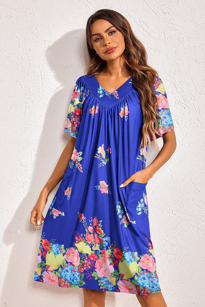 Floral print nightdress in cobalt blue with multicolor blooms, gathered V-neck, side pockets