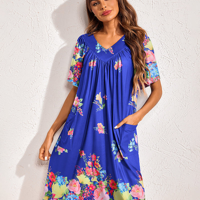 Floral print nightdress in cobalt blue with multicolor blooms, gathered V-neck, side pockets