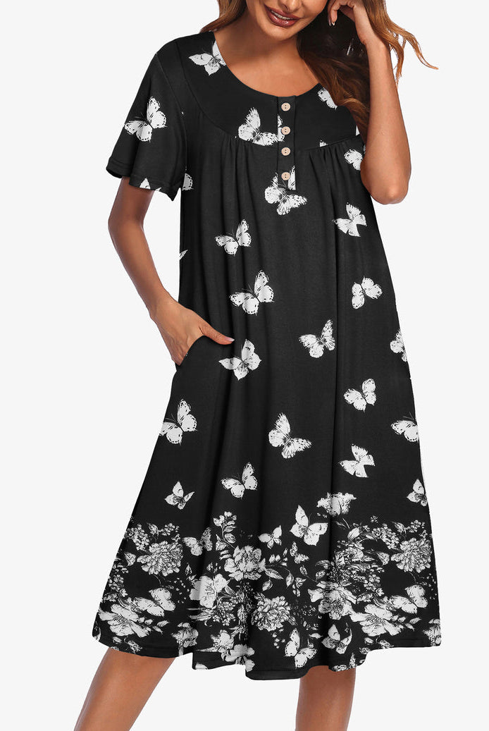 Black short-sleeve dress with white butterfly print and button-up yoke