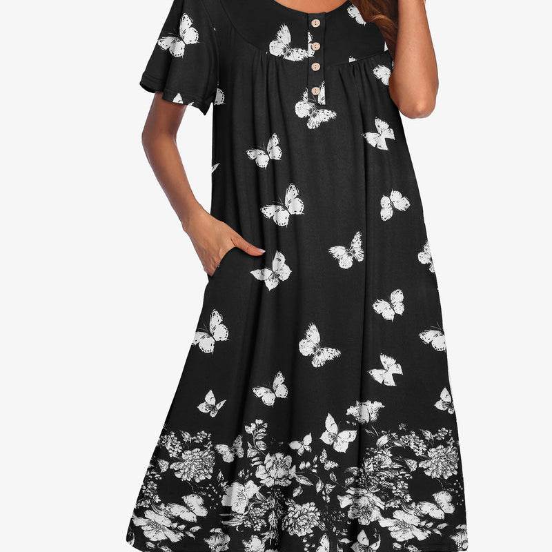 Black short-sleeve dress with white butterfly print and button-up yoke