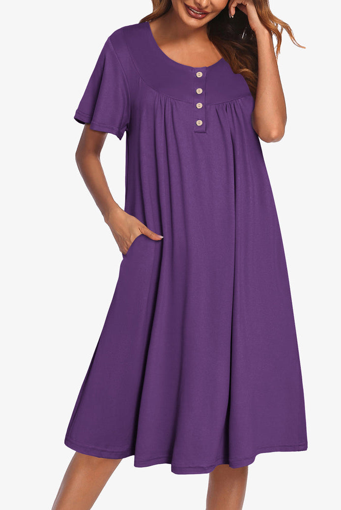 Purple short-sleeve dress with button front and gathered yoke