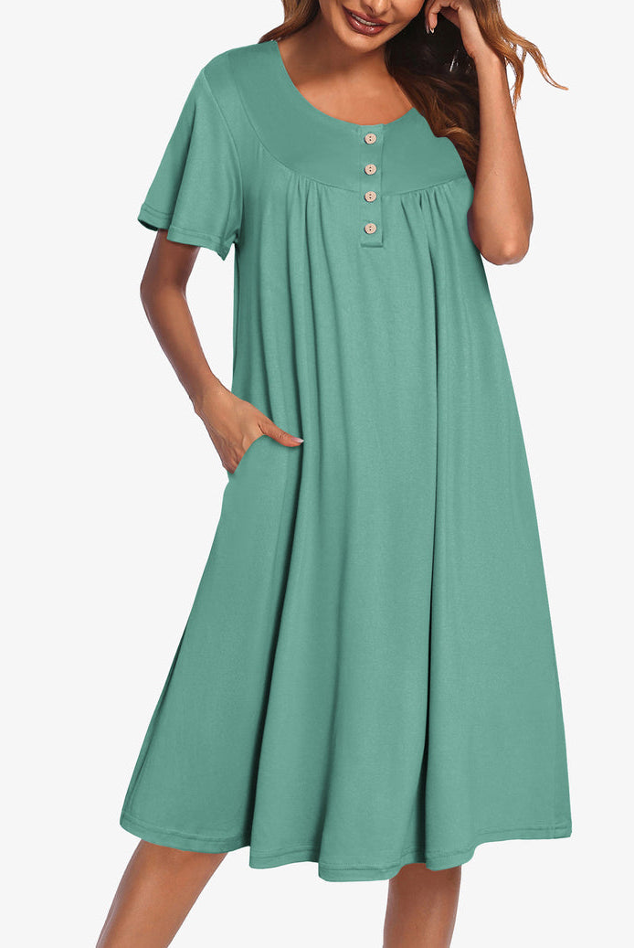 Green short-sleeve dress with button front and gathered yoke
