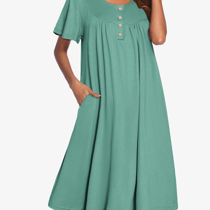 Green short-sleeve dress with button front and gathered yoke