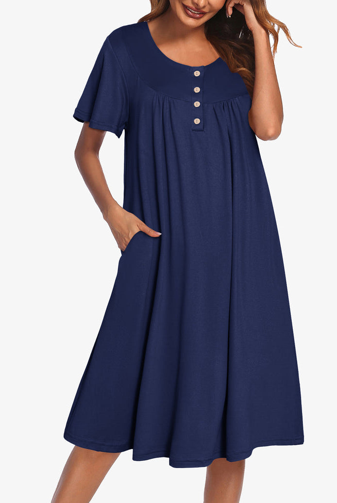 Navy blue short-sleeve dress with button front and gathered yoke
