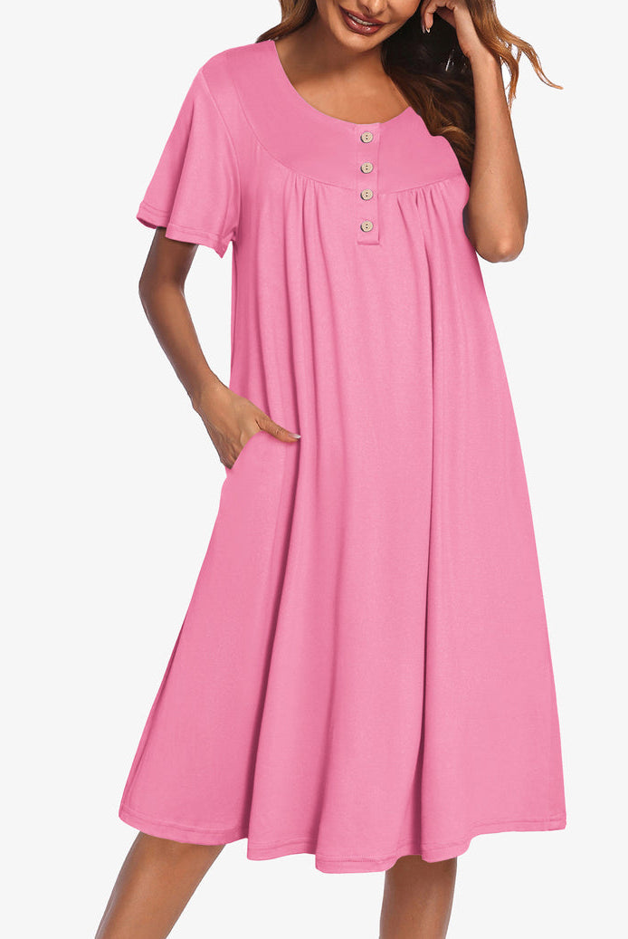 Pink short-sleeve dress with button front and gathered yoke