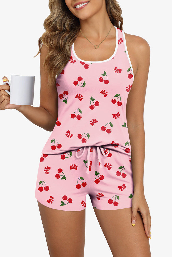 Pink pajama cami and shorts set with red cherry and bow print (front)