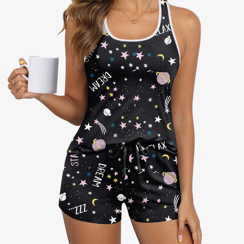 Women’s pajama set with dark star-and-space print cami and matching drawstring shorts