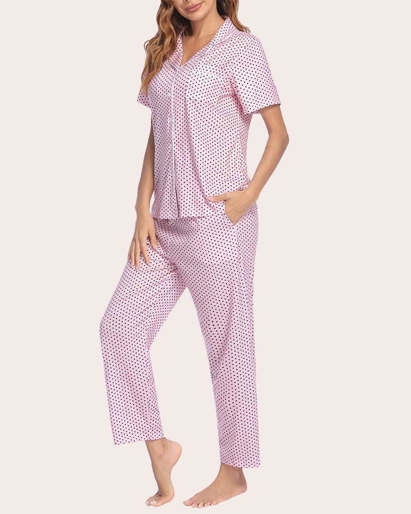 Pink polka dot pajamas set. Soft, comfy women's sleepwear with white trim and button-down detail.