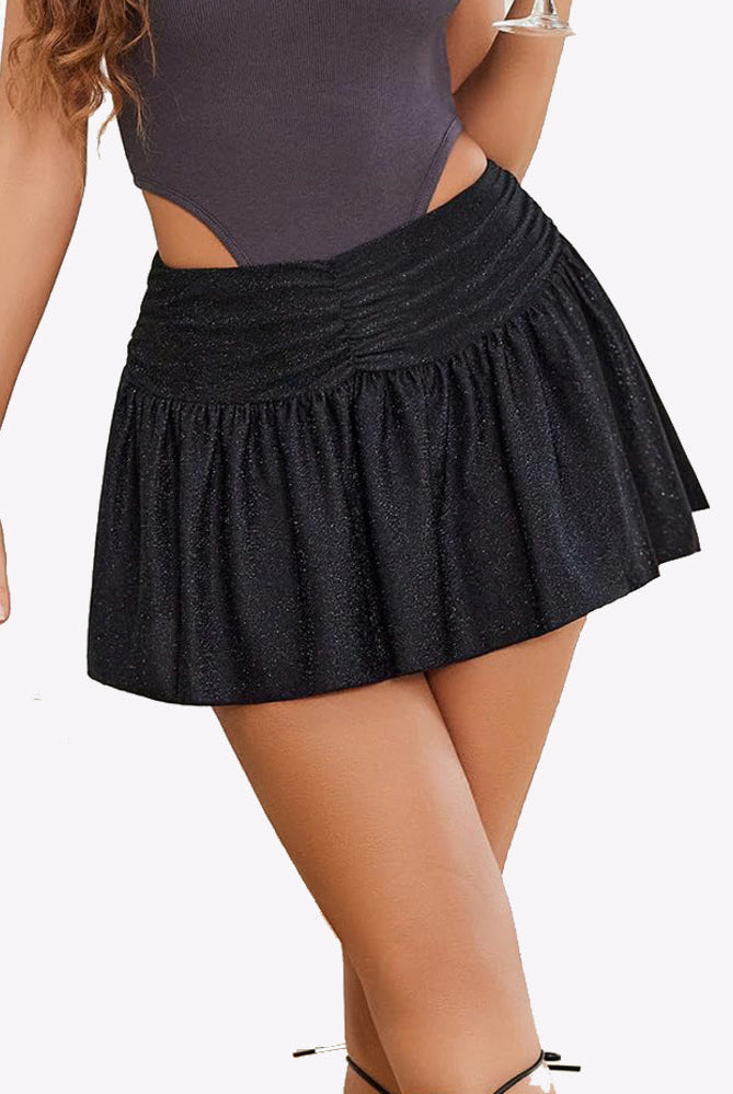 Black glitter mini skirt with ruffle hem, A-line silhouette, paired with a grey bodysuit.