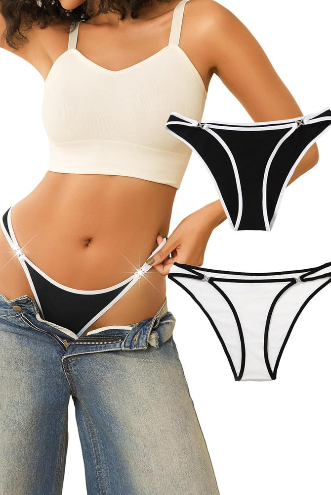 Black low rise thong panty with rhinestone accents, white trim, sensual lingerie, beige crop top.