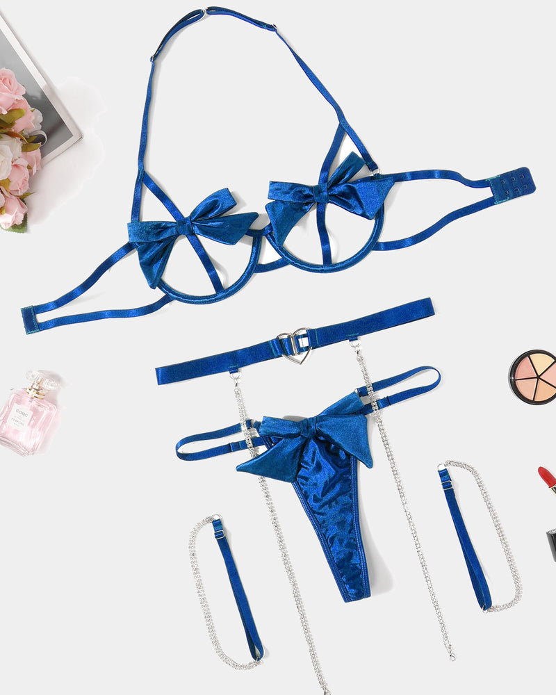 Blue satin bow lingerie set with underwire bra, heart cutout, chain details, garter belt, and thong