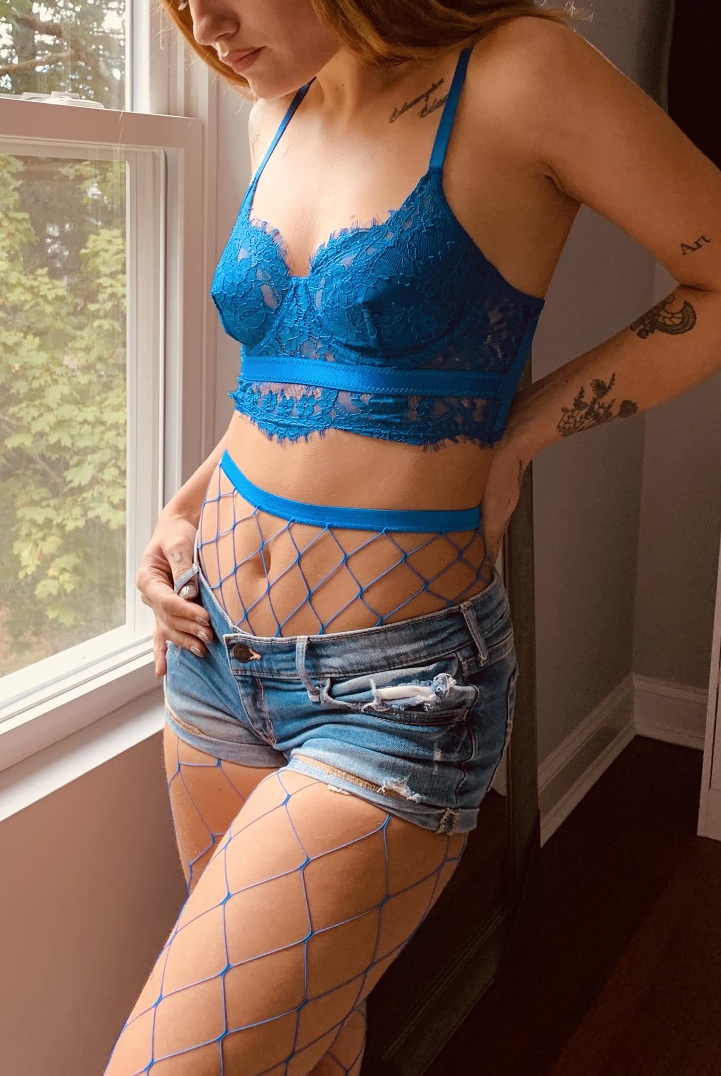 Avidlove blue fishnet stockings with matching lace bra, denim shorts, perfect for confident women