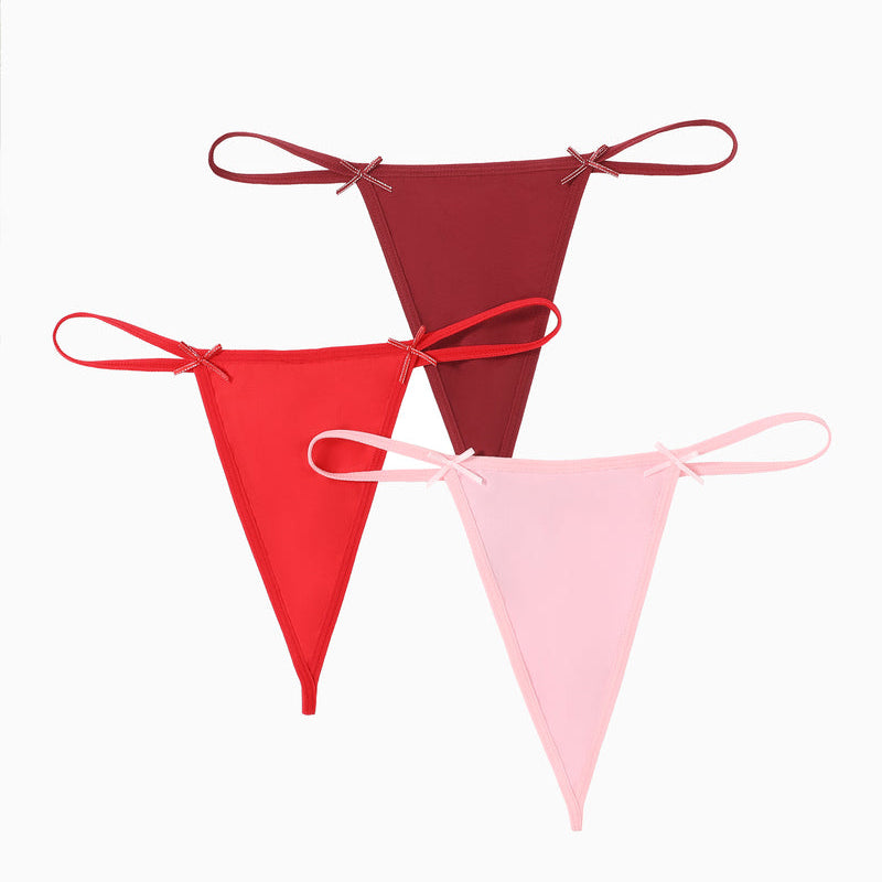 Avidlove G-string thong 3-pack in red, burgundy, and pink. Sexy lingerie with bow details.