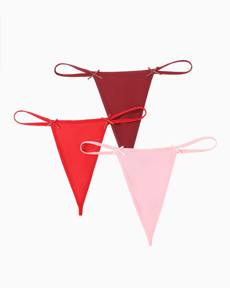Avidlove G-string thong 3-pack in red, burgundy, and pink. Sexy lingerie with bow details.