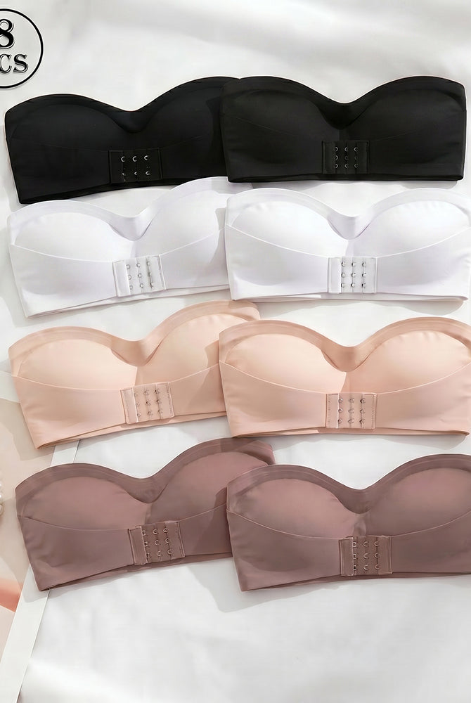 Set of strapless bandeau tops with buckle front in black, white, nude, and brown