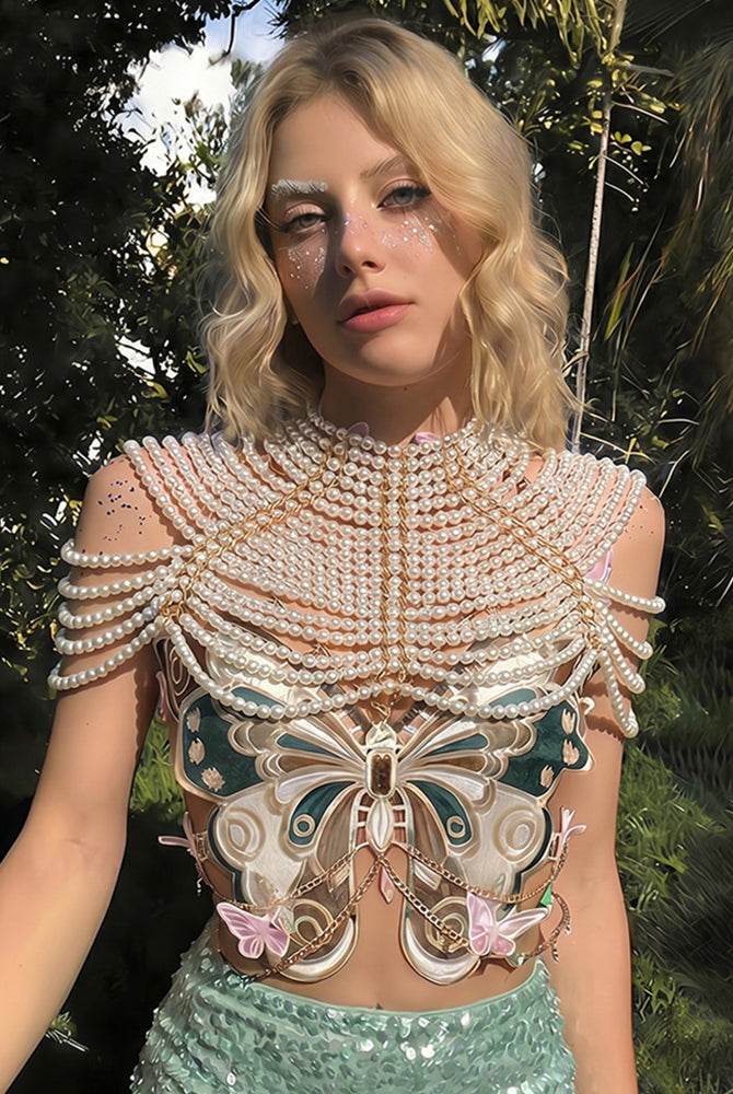 Embroidered butterfly top with pearl chain and sequin shoulder detail; green sequin mini skirt