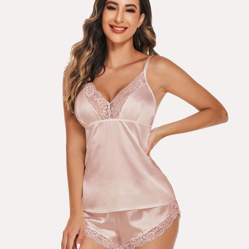 Pink satin cami shorts set with lace trim. Comfortable and stylish lingerie.