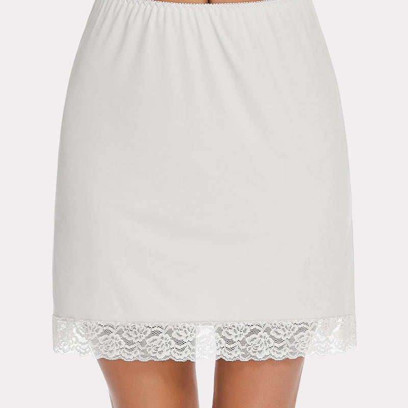 White half slip skirt with lace trim, above knee length, and elastic waist for comfort