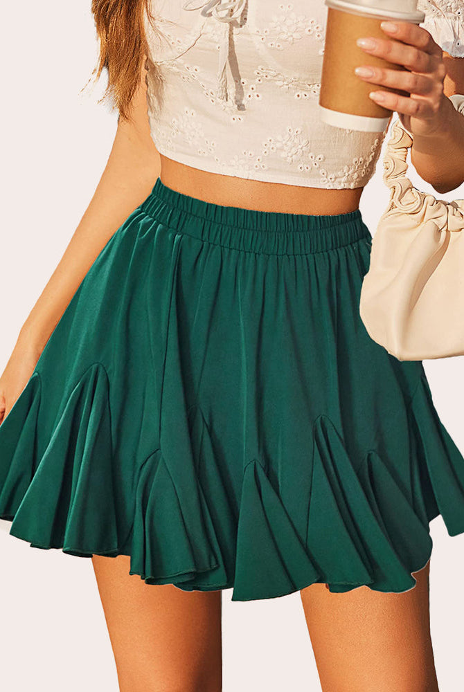 Green pleated ruffle flared mini skirt with elastic waistband and gathered hem.