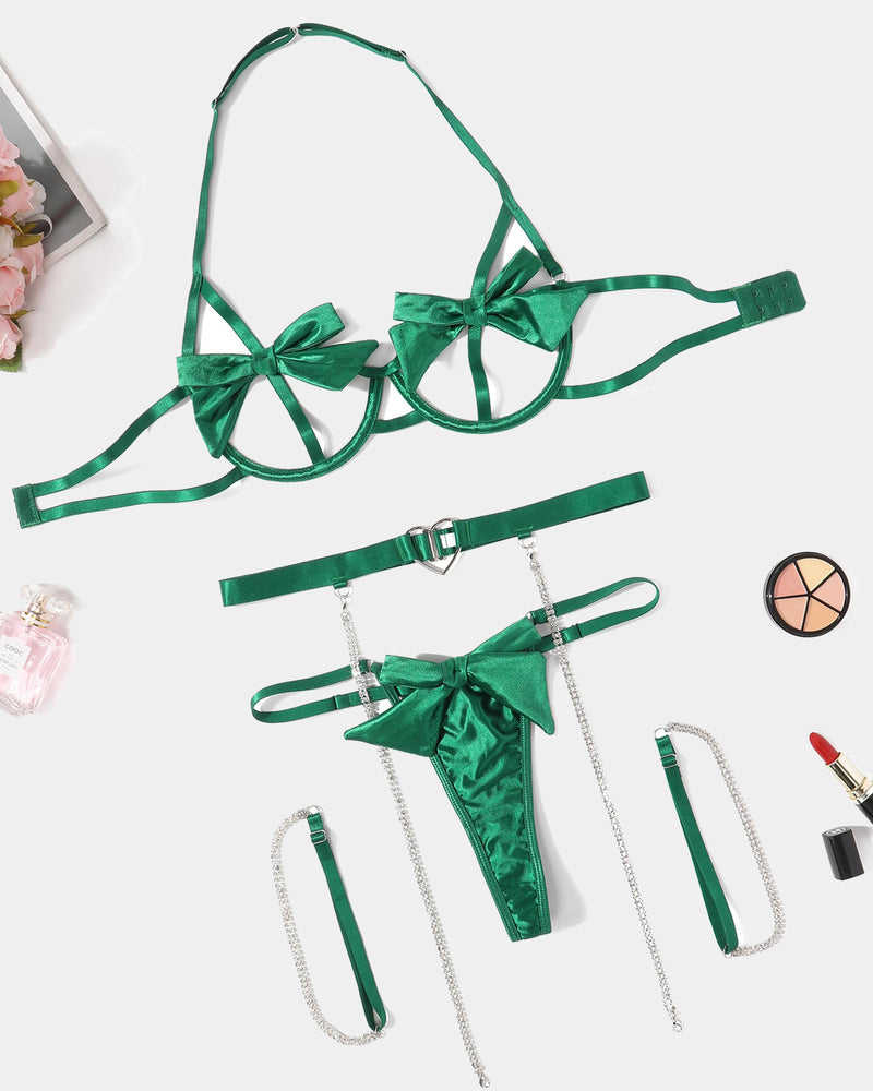 Green satin bow lingerie set with heart cutout, chain details, garter belt, and g-string