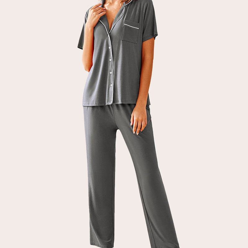 Charcoal gray notch collar soft pajamas set with white trim, button-down top, and long pants.