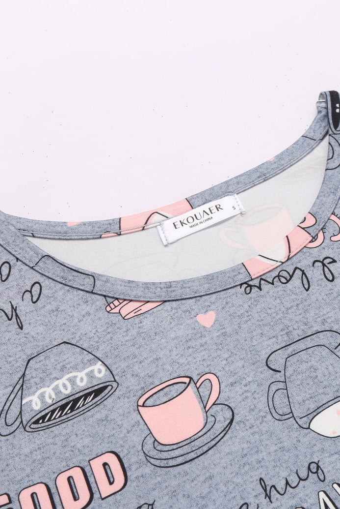 Grey printed pajama tank top with pink cups and heart doodle graphics.
