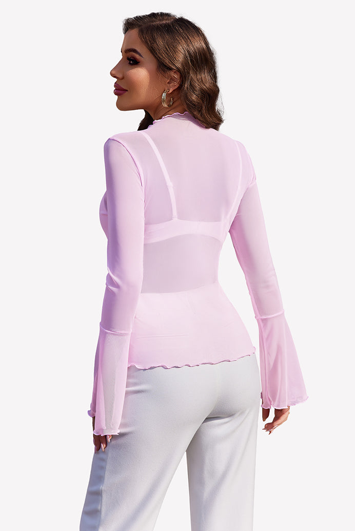 Pink mesh bell sleeve top with bell sleeves and white pants, a stylish look