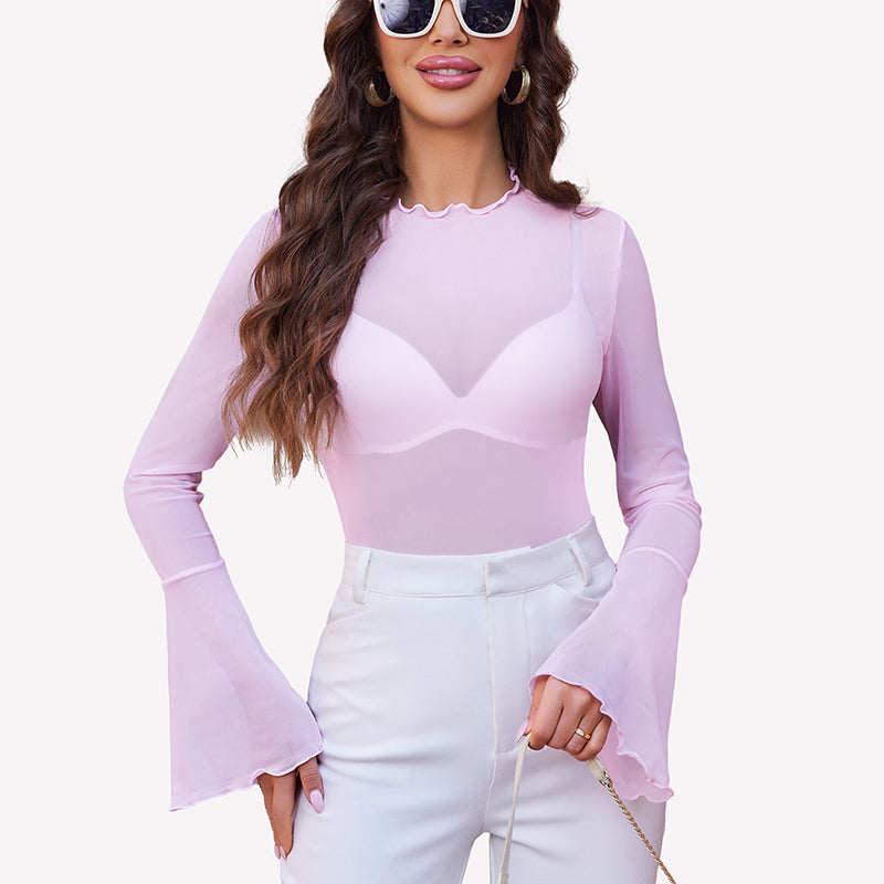 Pink mesh bell sleeve top with white pants. A stylish and confident look.