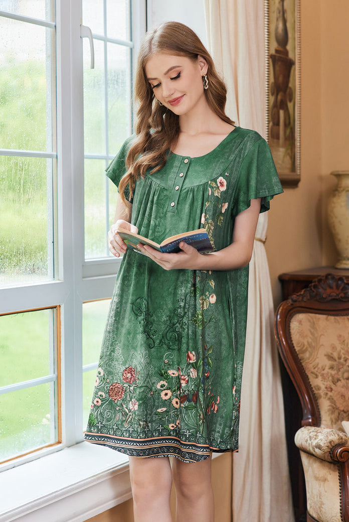 Women’s short sleeve green floral dress with vertical button placket.
